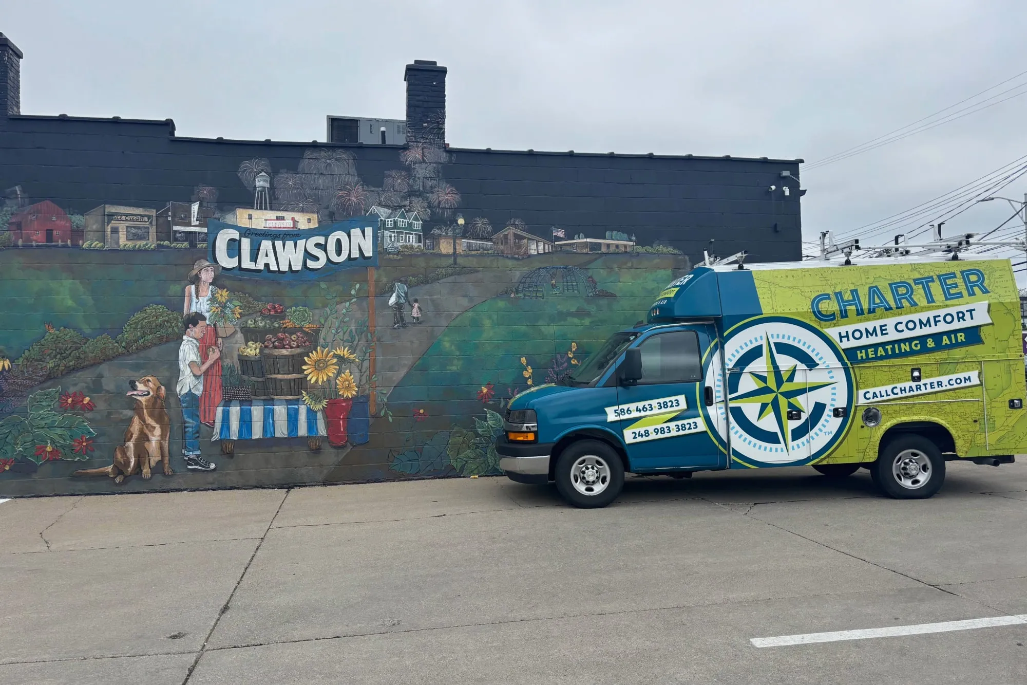 Charter Home Comfort Van parked by a Mural In Clawson MI